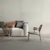 Image of a living room with chair and sofa, image focused on Ashlee Clay Stone Floor Tiles used in the room