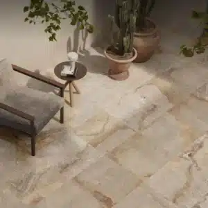 Minimalistic rest area focusing on sofa chair and Lapideus Stone Floor Tile