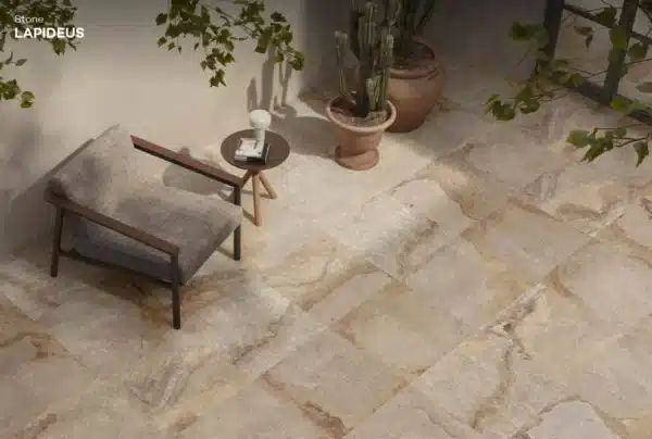 Minimalistic rest area focusing on sofa chair and Lapideus Stone Floor Tile