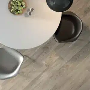 closeup image of coffee table and wood floor , highlighting Line Wood Floor Tile by Ashlee