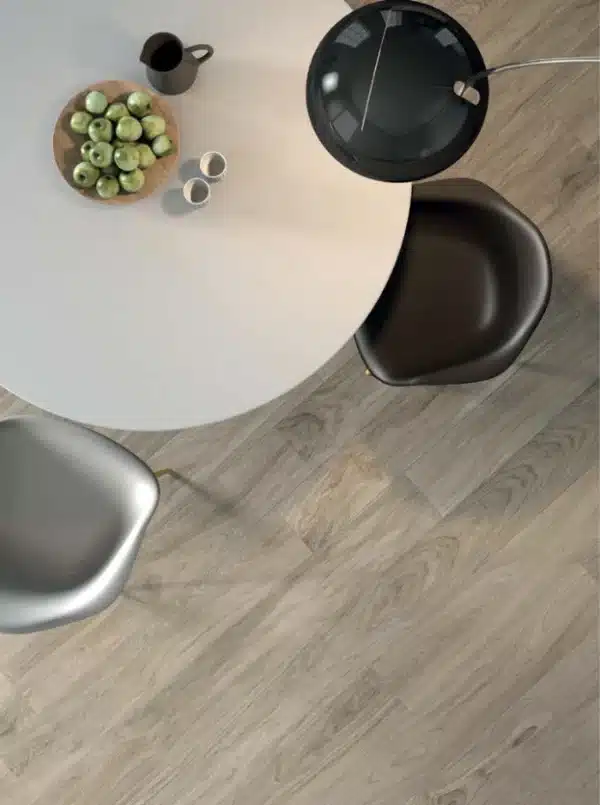 closeup image of coffee table and wood floor , highlighting Line Wood Floor Tile by Ashlee