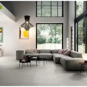 image of a modern living room with netural theme sitting focusing on floor made of Shine Stone floor tiles by Ashlee