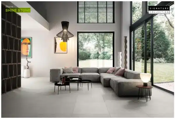 image of a modern living room with netural theme sitting focusing on floor made of Shine Stone floor tiles by Ashlee