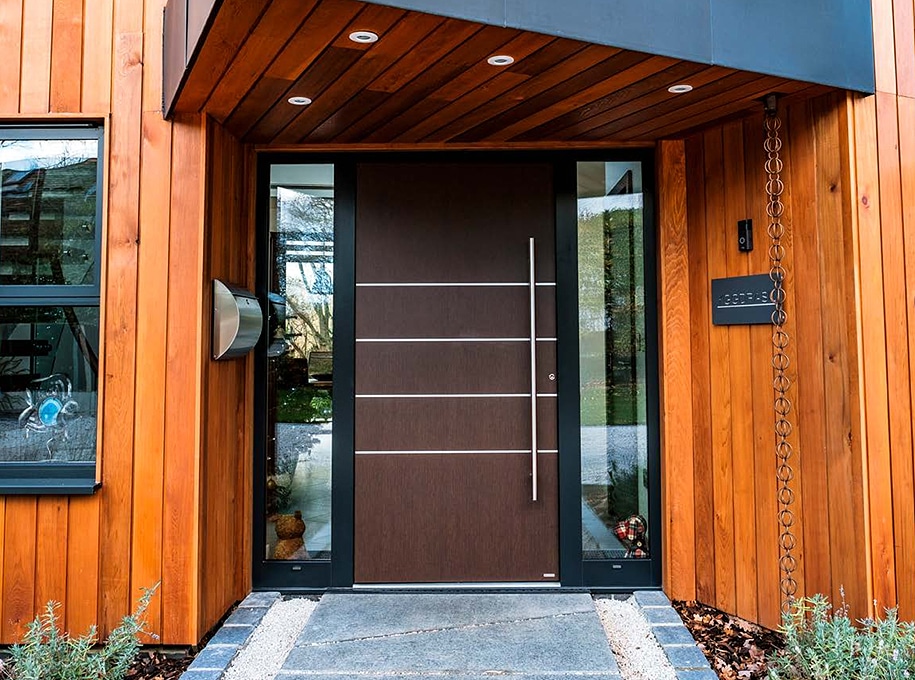 External brown door with 4 silver metal bars running across it